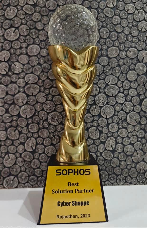 A gold trophy holding a crystal globe, plaque reading "Sophos, Best Solution Partner, Cyber Shoppe, Rajasthan, 2023".